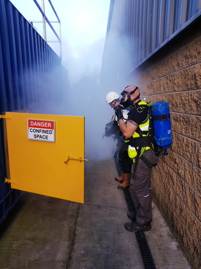 Confined Space Training In Action, Photo of a man wearing all the PPE.